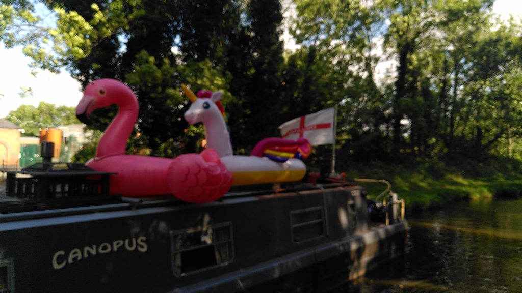 Flamingo, Unicorn and St George Flag on a Narrowboat