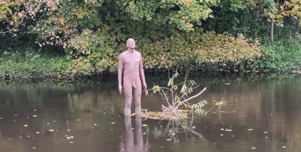 Antony Gormley Statue in Water of Leith