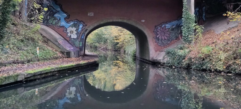 Brick canal bridge with graffiti art both sides
