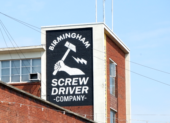 The former Birmingham Screw Driver Company building.  A mural on the building depicts a hand wielding a large hammer.