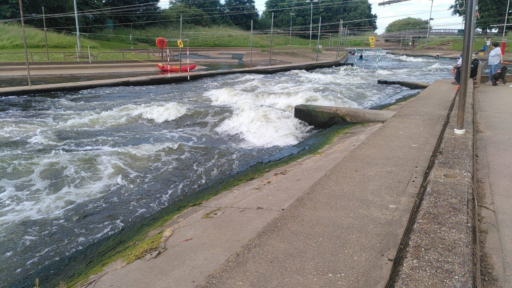Rapids.  A concrete course with water rushing down it.  There are slalom poles hung above and standing waves breaking in the water.  This is no place for a narrowboat.